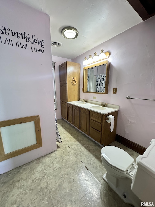 1677 E Smokey Rd, Avon, IL 61415 - bathroom featuring toilet and vanity