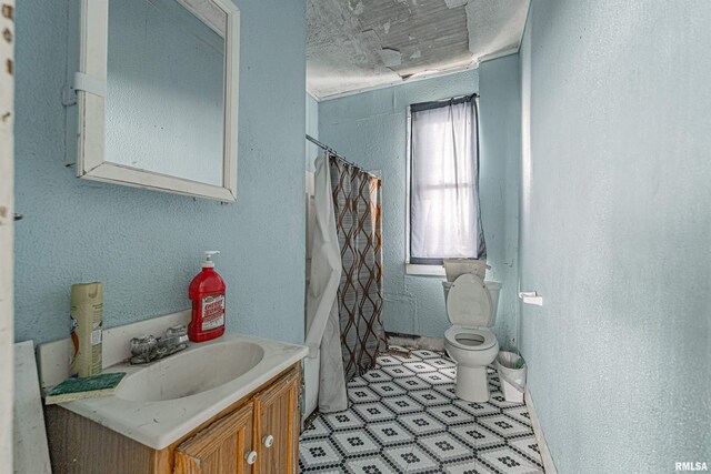 full bathroom featuring vanity, toilet, and separate shower and tub