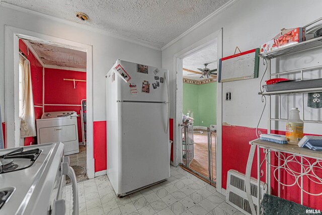 kitchen featuring crown molding, white appliances, washer / clothes dryer, ceiling fan, and a textured ceiling