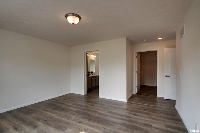 spare room featuring dark hardwood / wood-style flooring