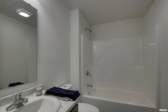 full bathroom featuring toilet, tub / shower combination, and vanity