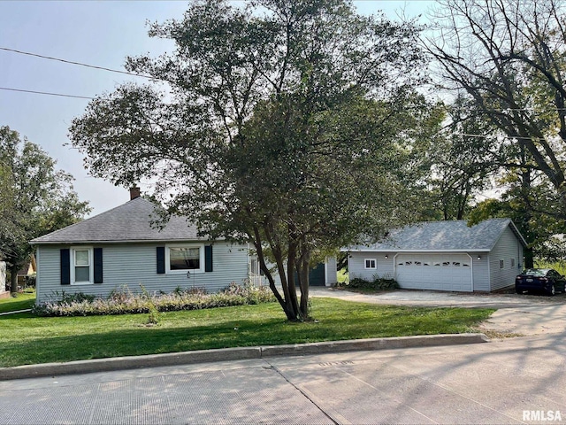 view of front facade with a front lawn and a garage