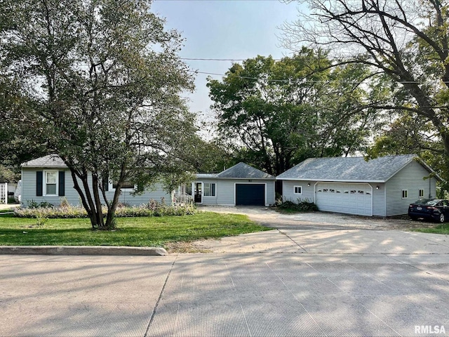 single story home with a garage and a front lawn