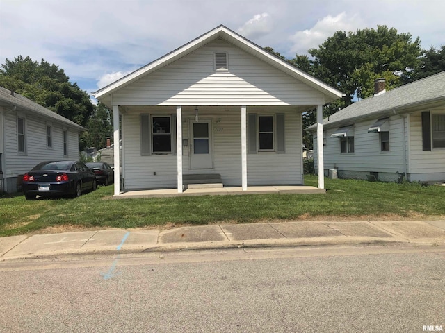 bungalow-style house featuring a front yard and a porch