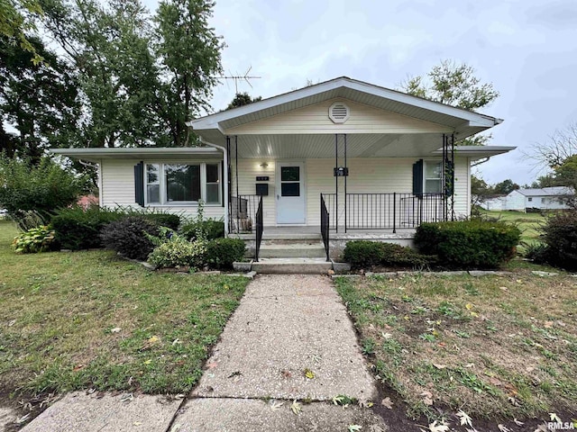 view of front of house featuring a front yard and covered porch