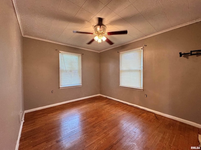 spare room with ceiling fan, ornamental molding, and dark hardwood / wood-style flooring