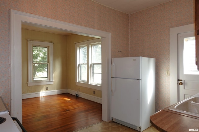 kitchen with sink and white fridge