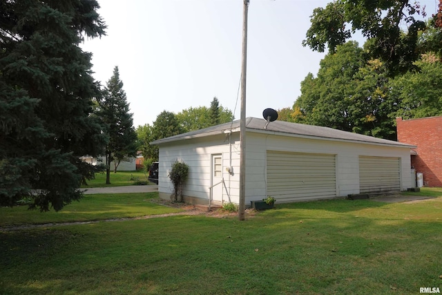 garage with a lawn