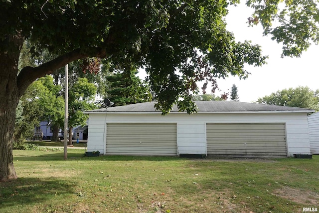 garage with a lawn