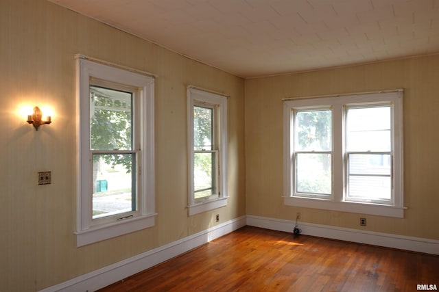 unfurnished room with light hardwood / wood-style floors