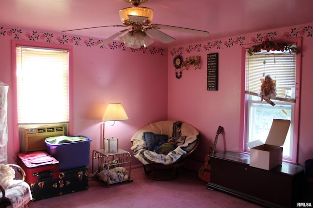 interior space with cooling unit, ceiling fan, and carpet floors