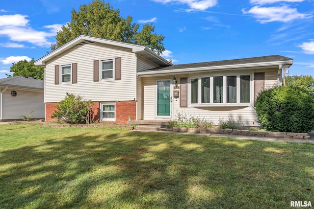 tri-level home with a front yard