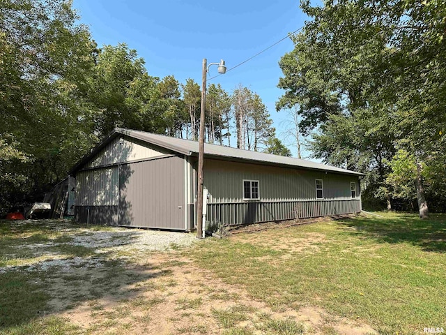 view of side of home featuring a lawn