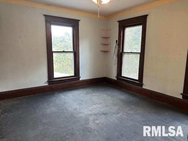 unfurnished room featuring plenty of natural light