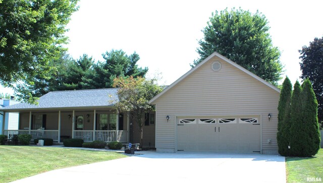 ranch-style home featuring a garage, a porch, and a front lawn