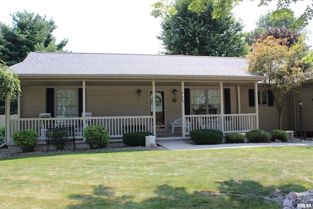 single story home featuring a front lawn and covered porch