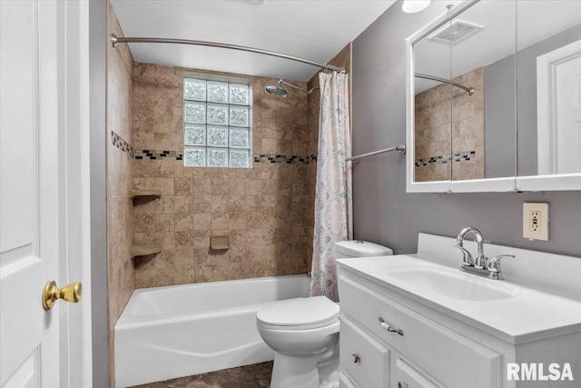 full bathroom featuring shower / tub combo, vanity, and toilet