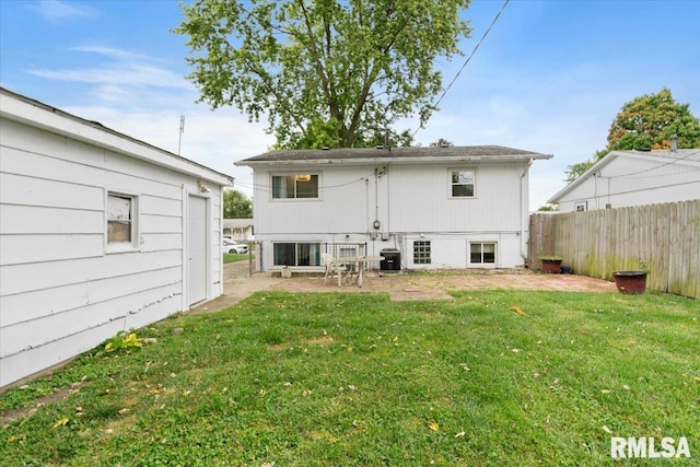 back of house with a yard and central air condition unit