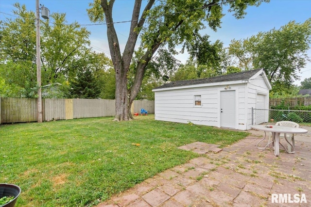 view of yard featuring a patio area and an outbuilding