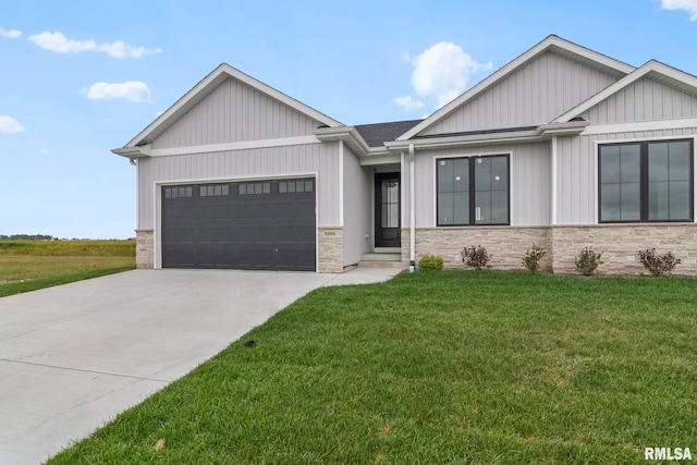 view of front of home featuring a garage and a front yard