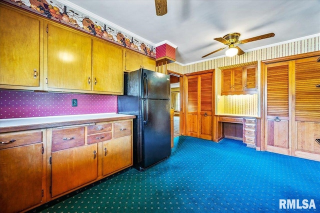 kitchen featuring ornamental molding, dark carpet, ceiling fan, and black fridge