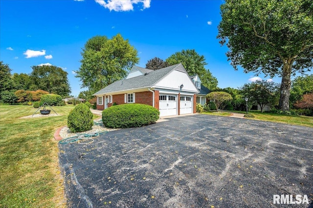 view of home's exterior featuring a garage and a yard