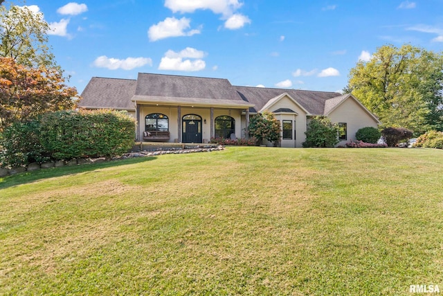 ranch-style house featuring a front lawn