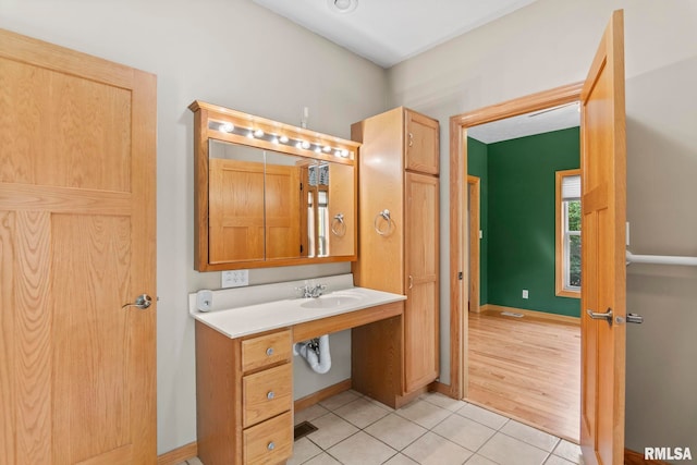 bathroom with hardwood / wood-style flooring and vanity