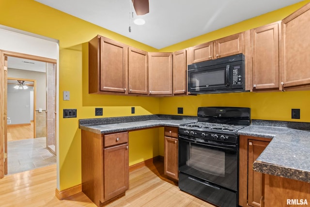 kitchen featuring light wood-type flooring, black appliances, and ceiling fan