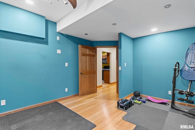 exercise area with hardwood / wood-style flooring