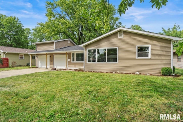 view of front of property with a garage and a front lawn