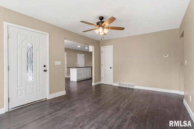 foyer entrance featuring ceiling fan and dark hardwood / wood-style flooring