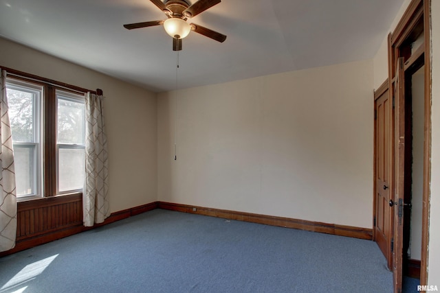 interior space featuring carpet floors and ceiling fan