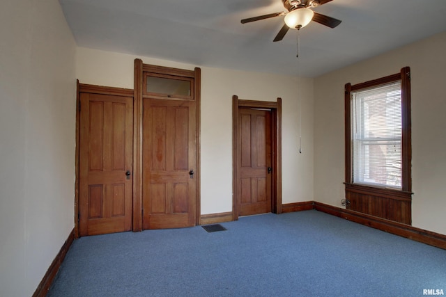 unfurnished bedroom with carpet floors and ceiling fan