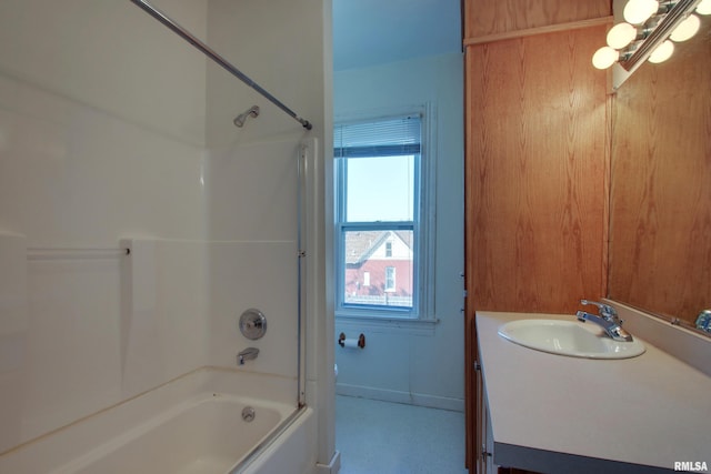 bathroom featuring vanity and  shower combination