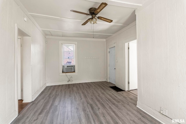 empty room with wood-type flooring and ceiling fan