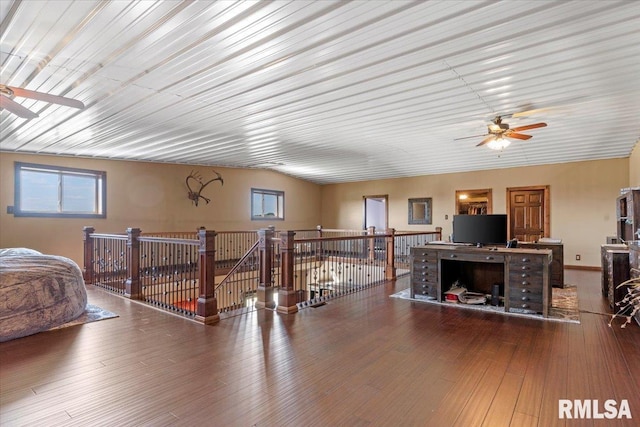 interior space featuring wood-type flooring and ceiling fan