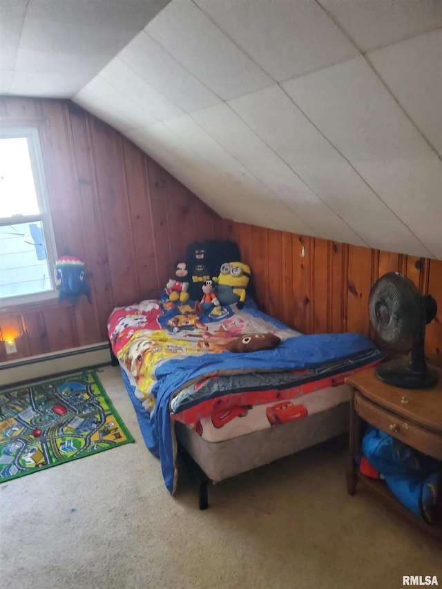 bedroom with wooden walls, lofted ceiling, baseboard heating, and carpet flooring