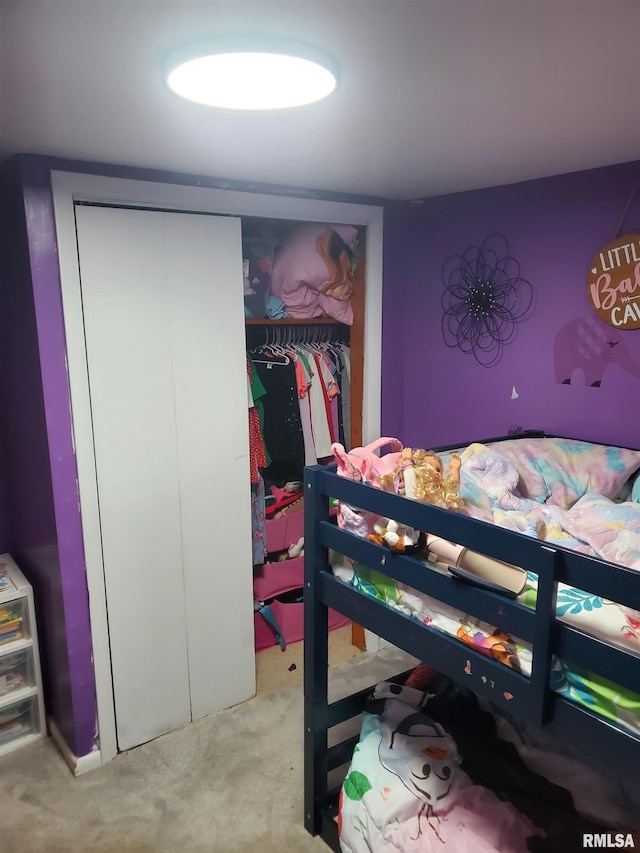 carpeted bedroom with a closet