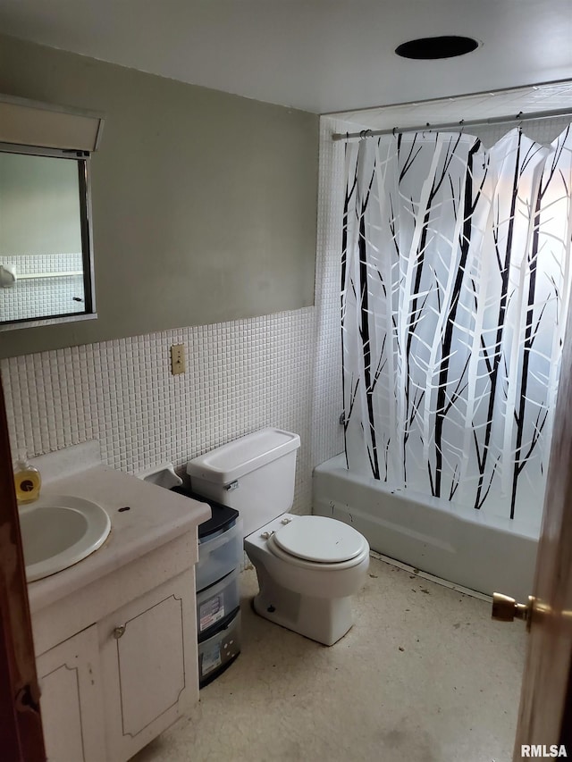 full bathroom featuring tile walls, shower / tub combo, vanity, and toilet