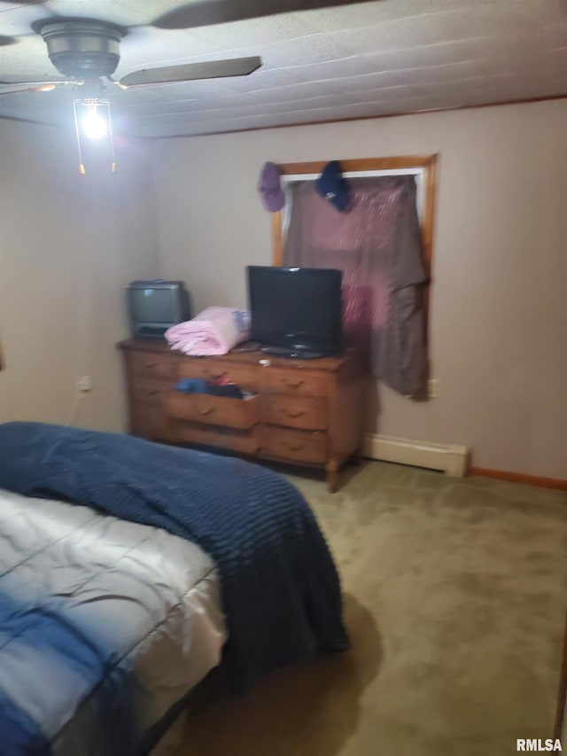 bedroom featuring ceiling fan, baseboard heating, and carpet flooring