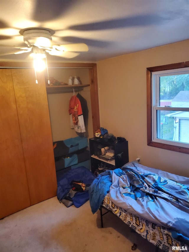 carpeted bedroom with ceiling fan