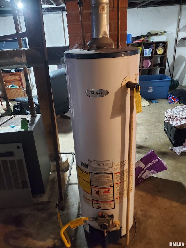 utility room featuring gas water heater