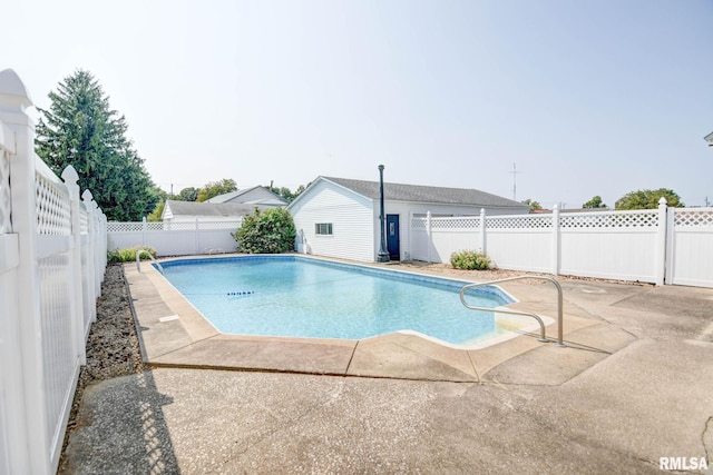 view of swimming pool with a patio area