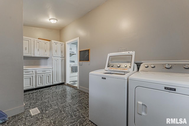 laundry room with washer and dryer