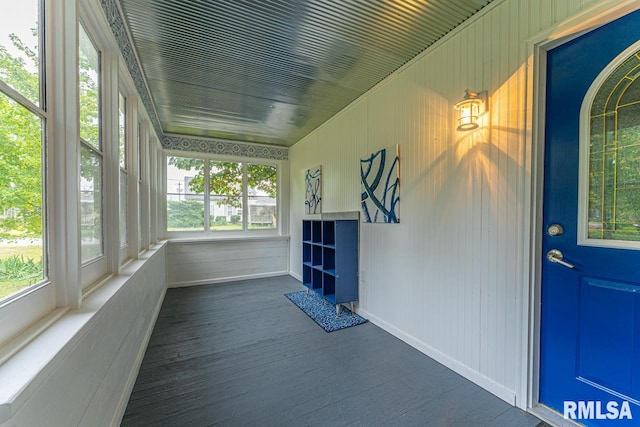 unfurnished sunroom with a wealth of natural light