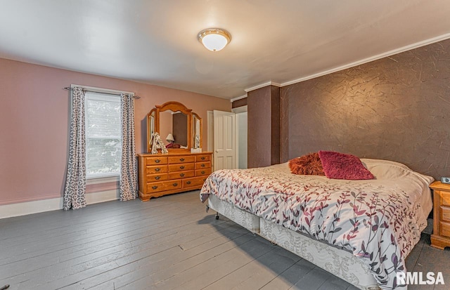 bedroom featuring wood-type flooring