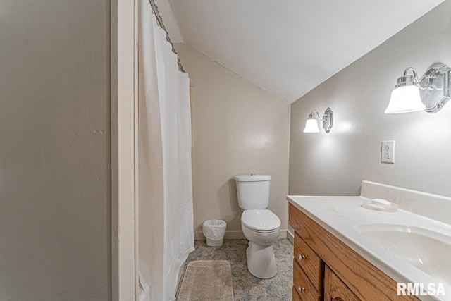 bathroom with vaulted ceiling, walk in shower, vanity, and toilet