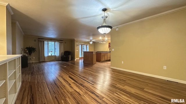 unfurnished living room with dark hardwood / wood-style flooring, ceiling fan, and crown molding