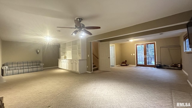 interior space featuring ceiling fan, built in features, and french doors